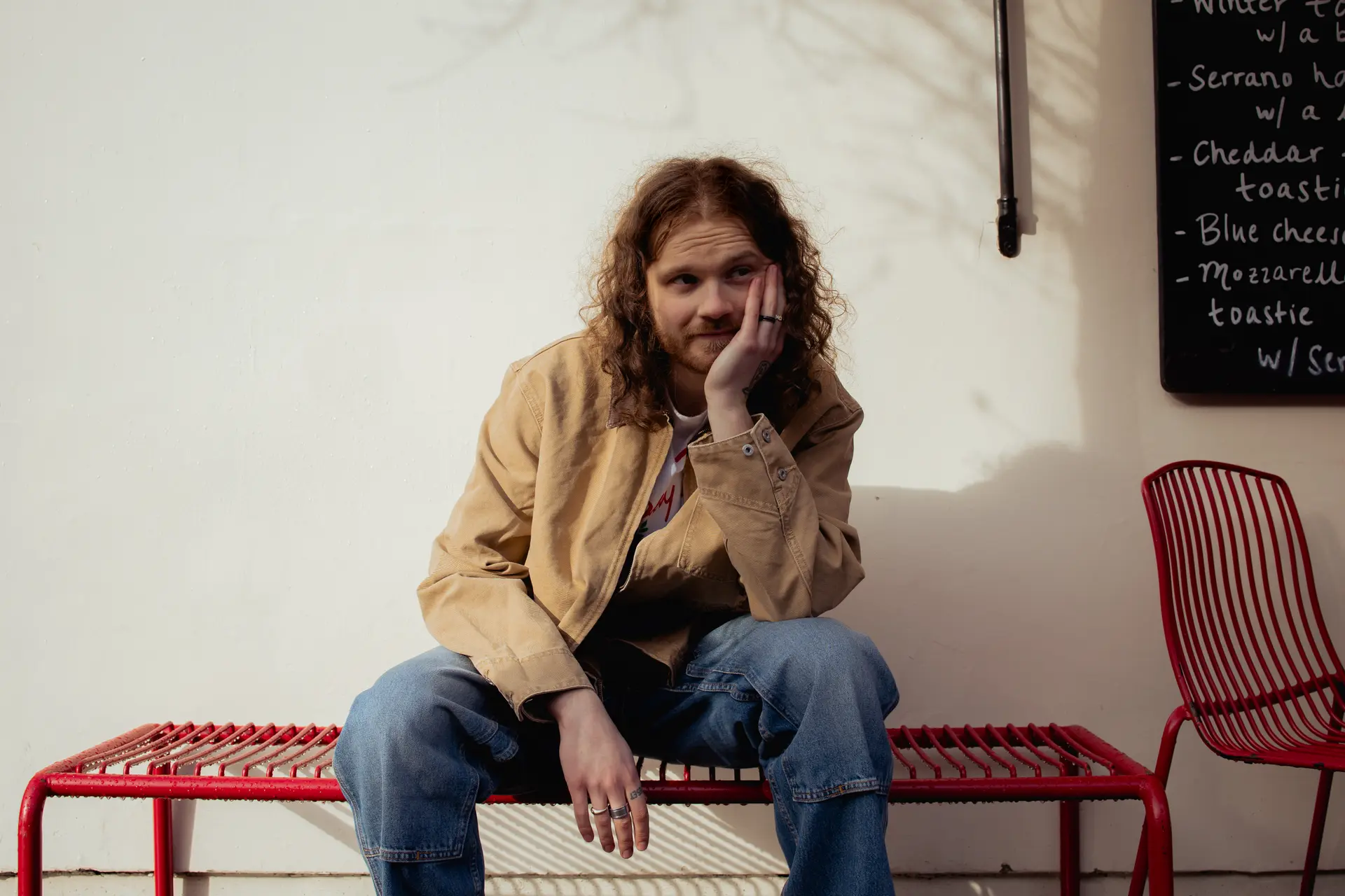 Brodie Barclay setting on a red bench