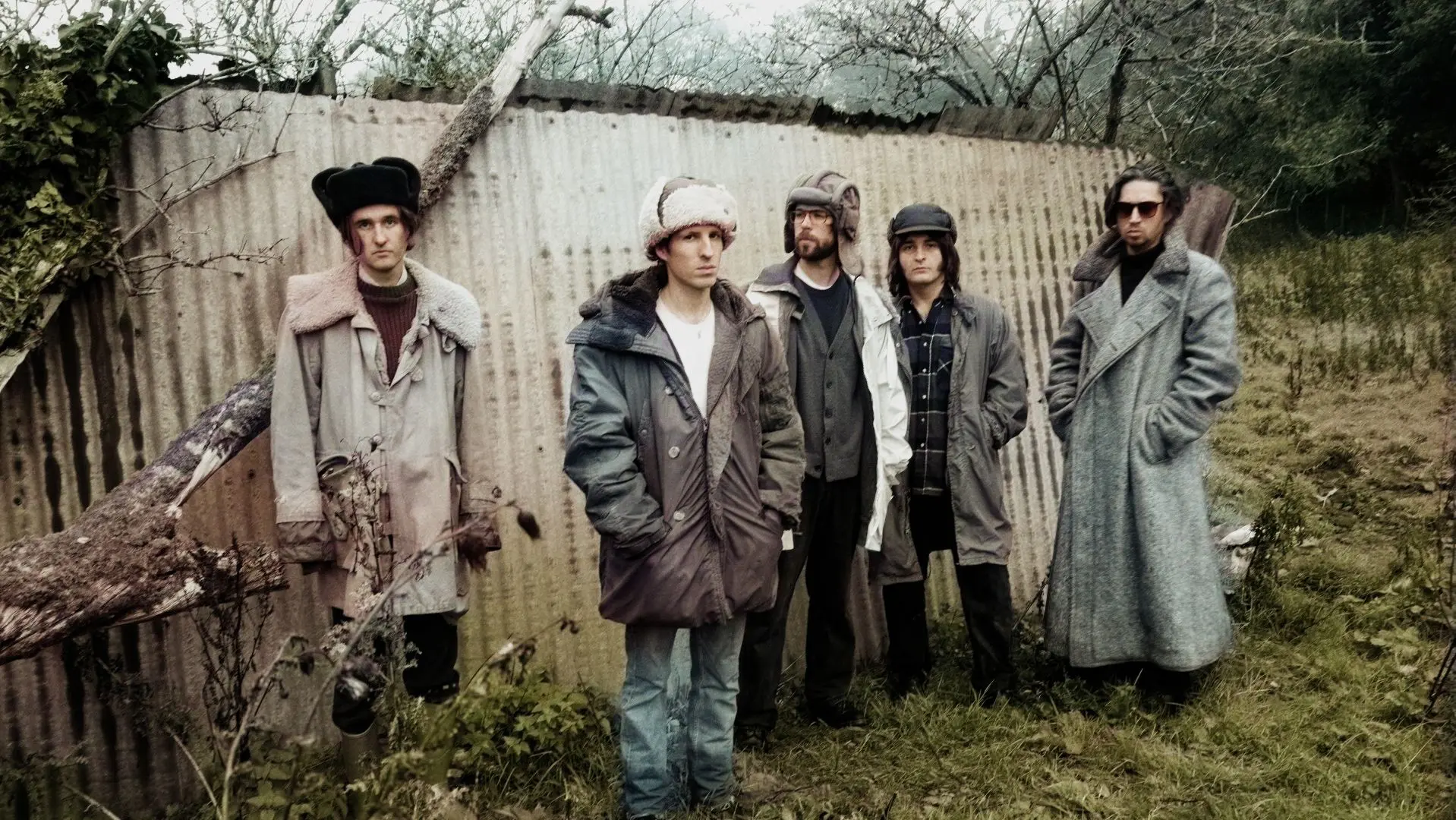 Swim Deep stood in a garden