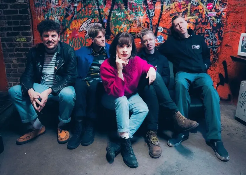 Five members of Skinny Lister looking into the camera