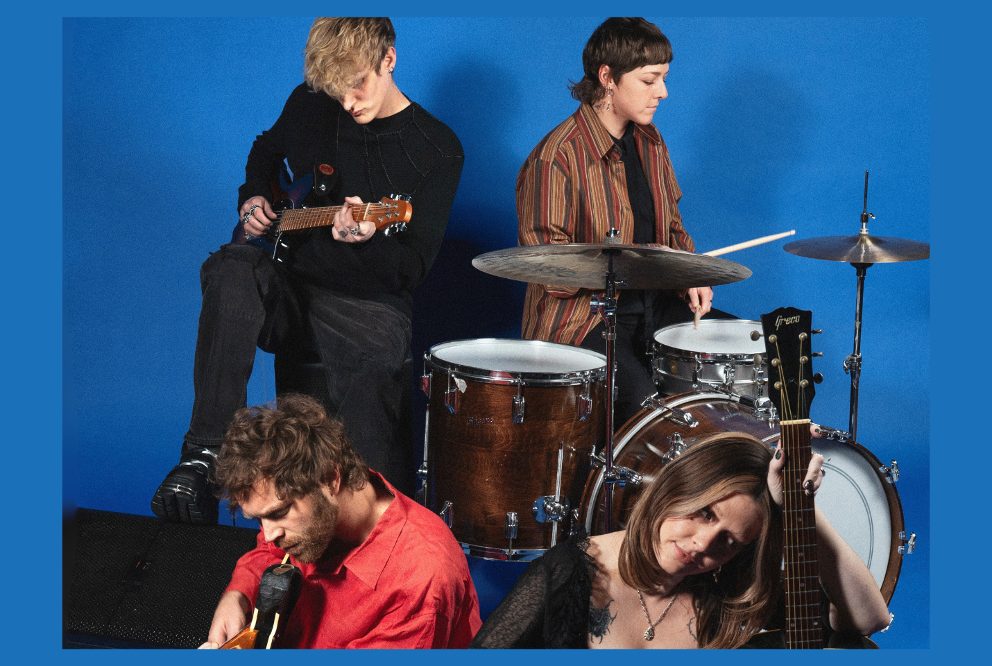 Artist Yumi Zouma performing against blue background