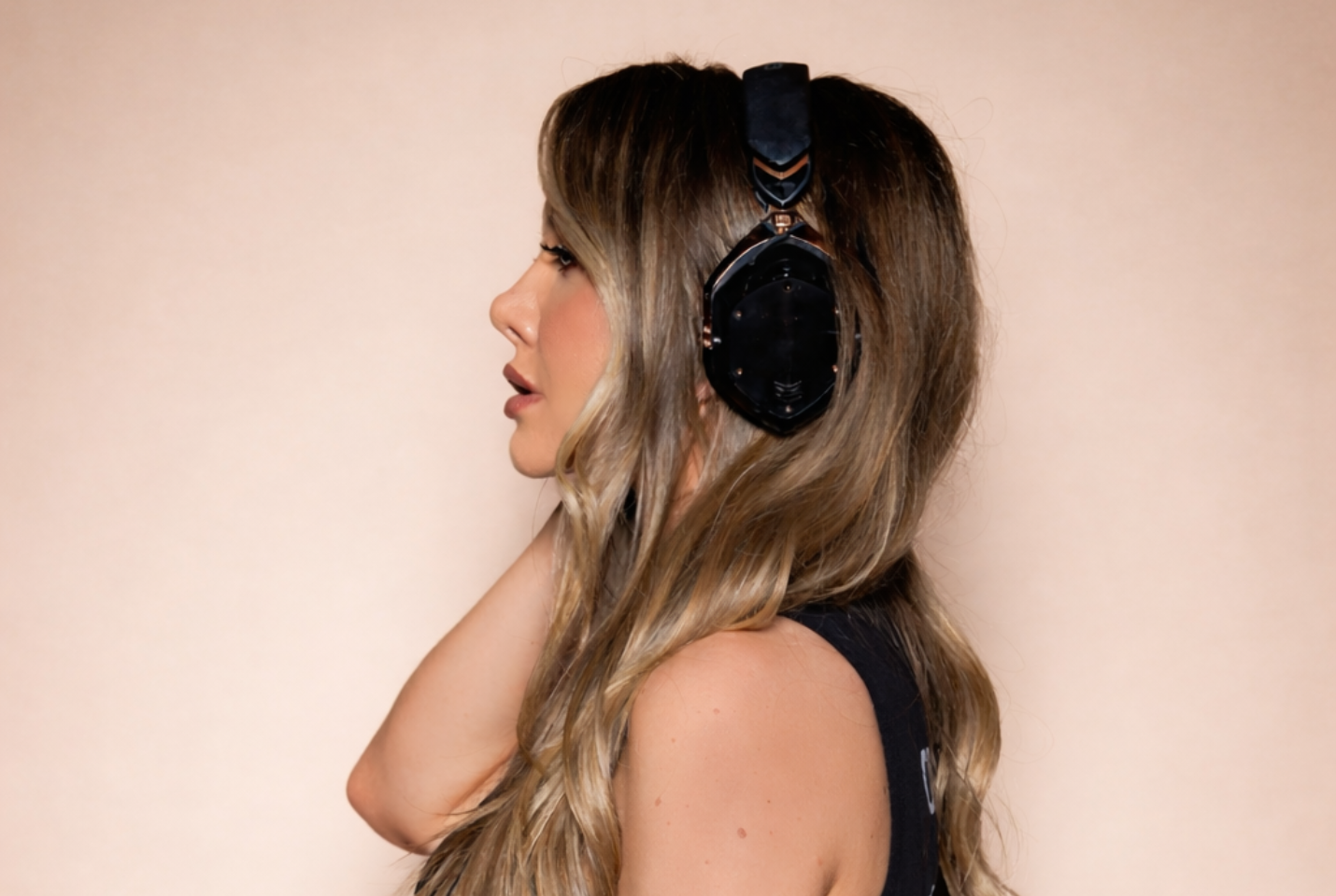 Side profile of CASSI with headphones on