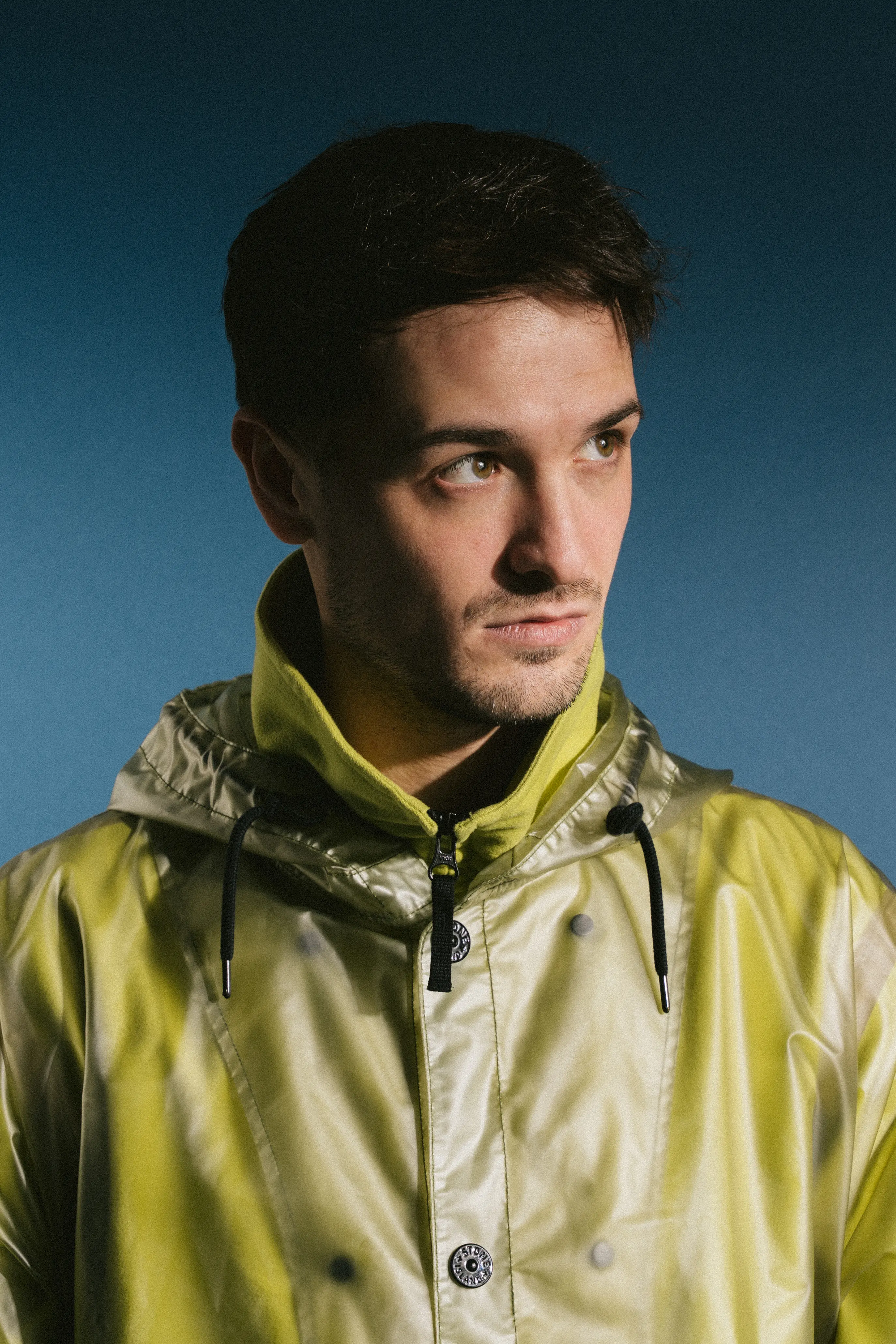Evan McVicar in green jacket against blue background