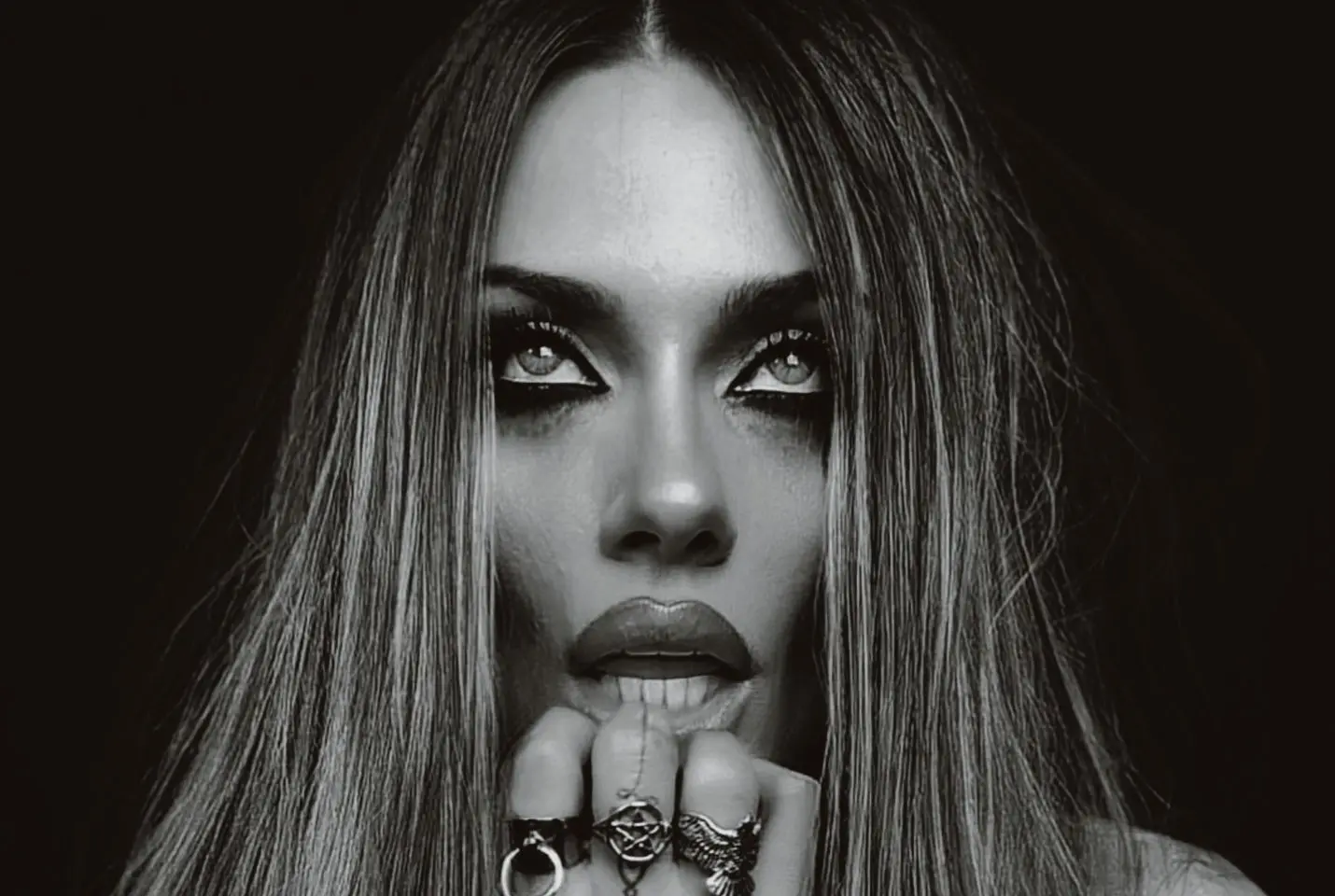 woman posing with dark eye makeup