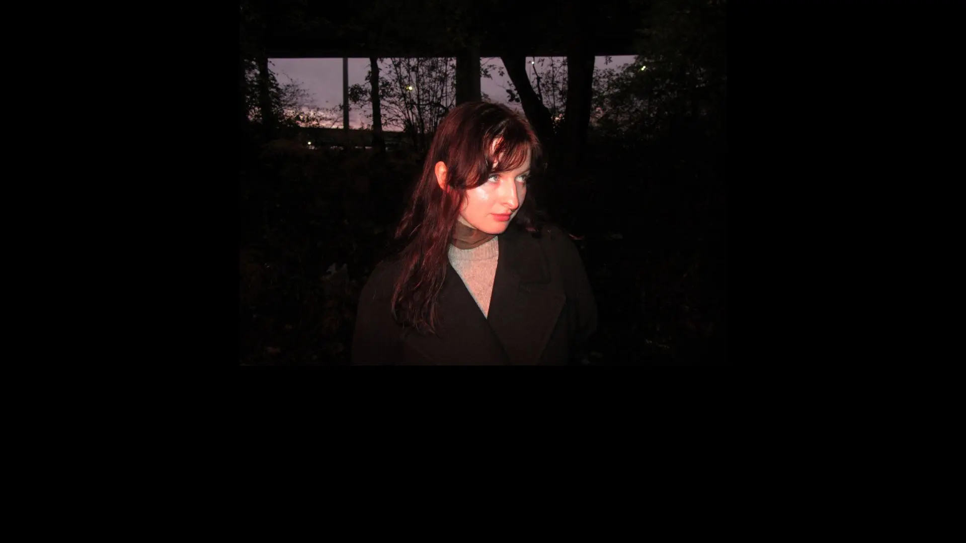 Theo Bleak in a black coat