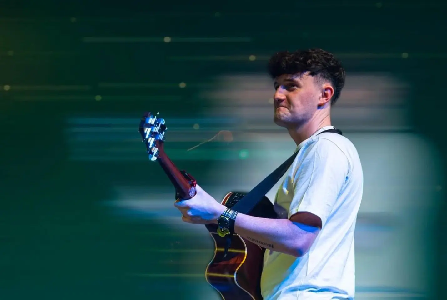 man holding guitar