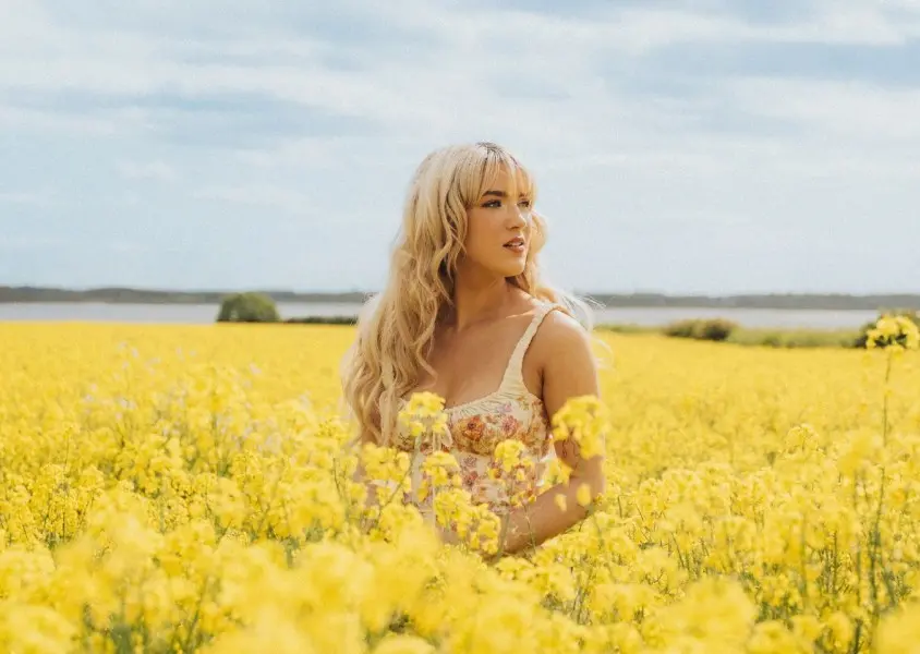 Rianne Downey in a yellow field
