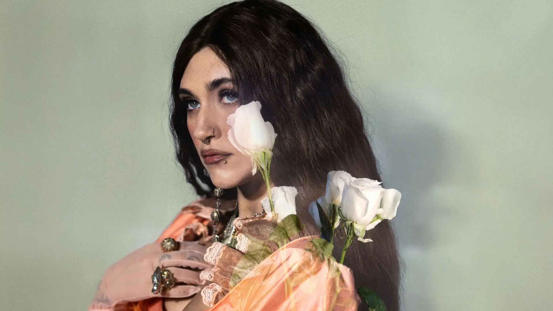 Sierra Ferrell in front of a green backdrop