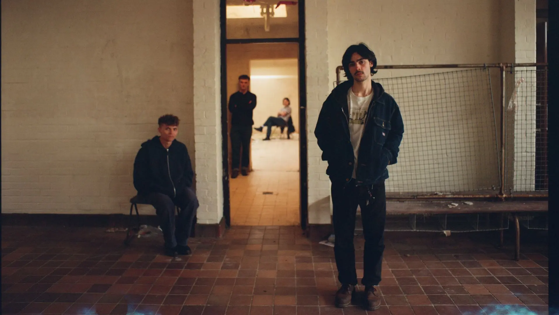 The band Little Grandad stood in an empty room
