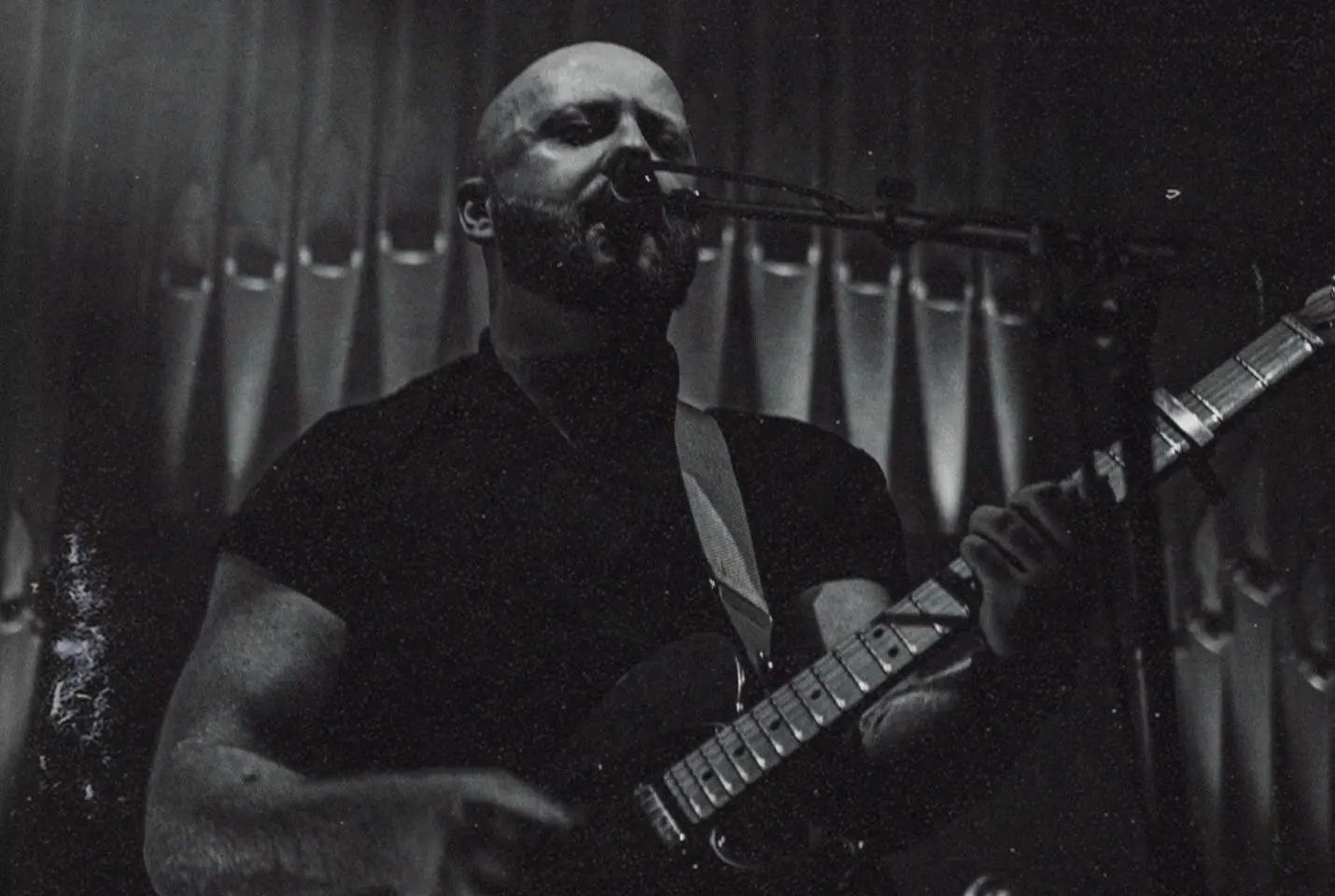 man holding guitar