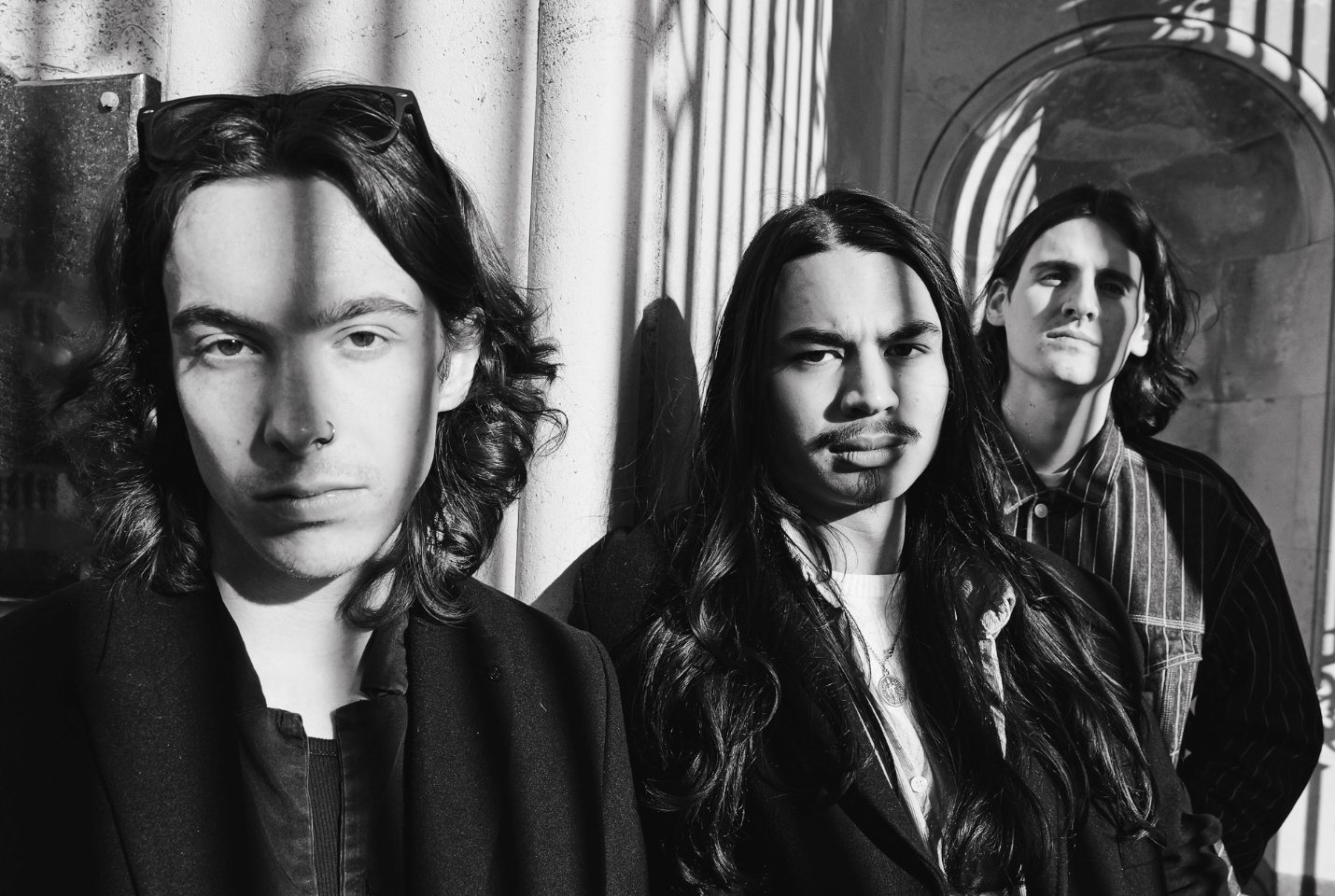 3 men of Bloodworm looking into the camera, black and white picture