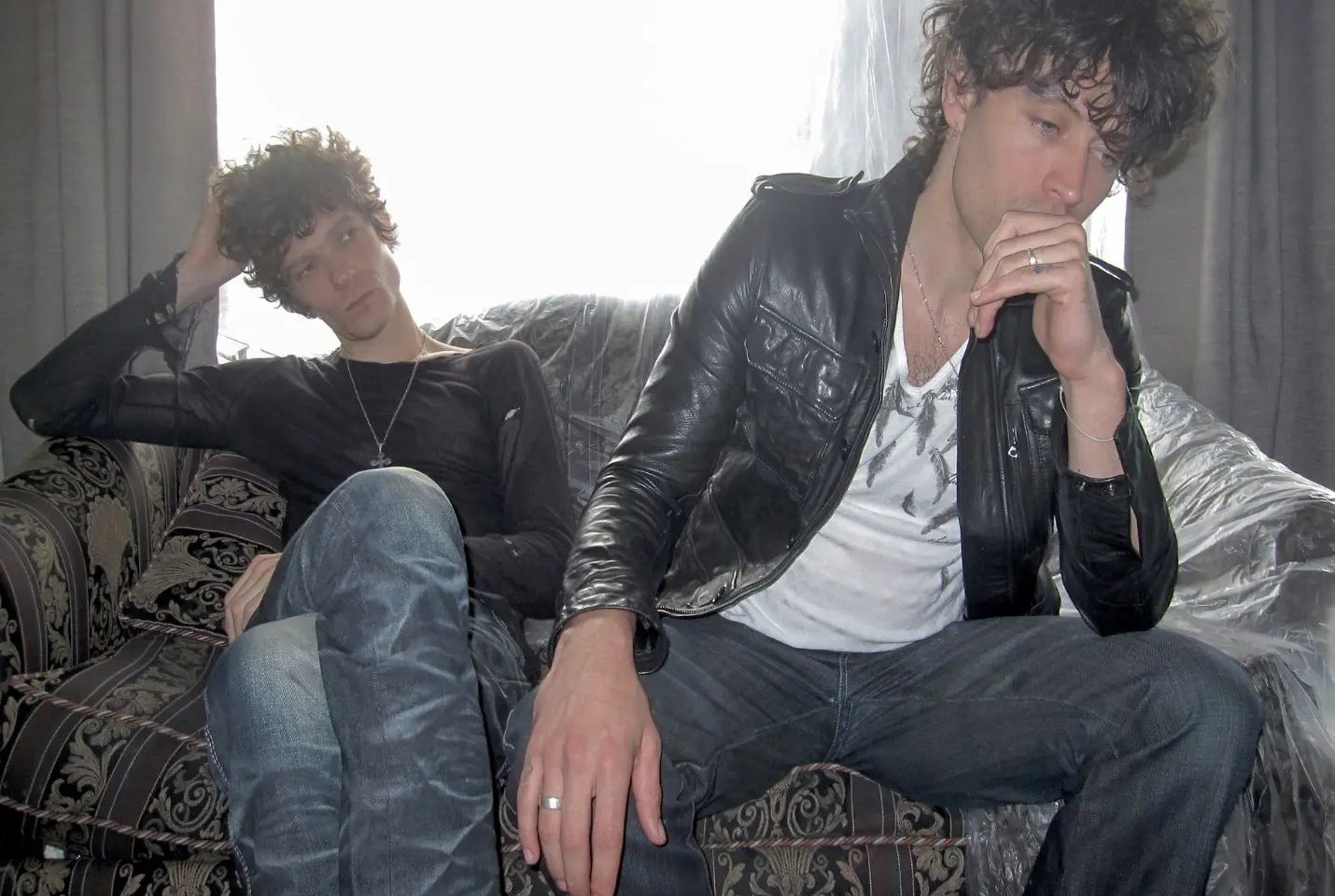 Duo Highschool sat on a sofa