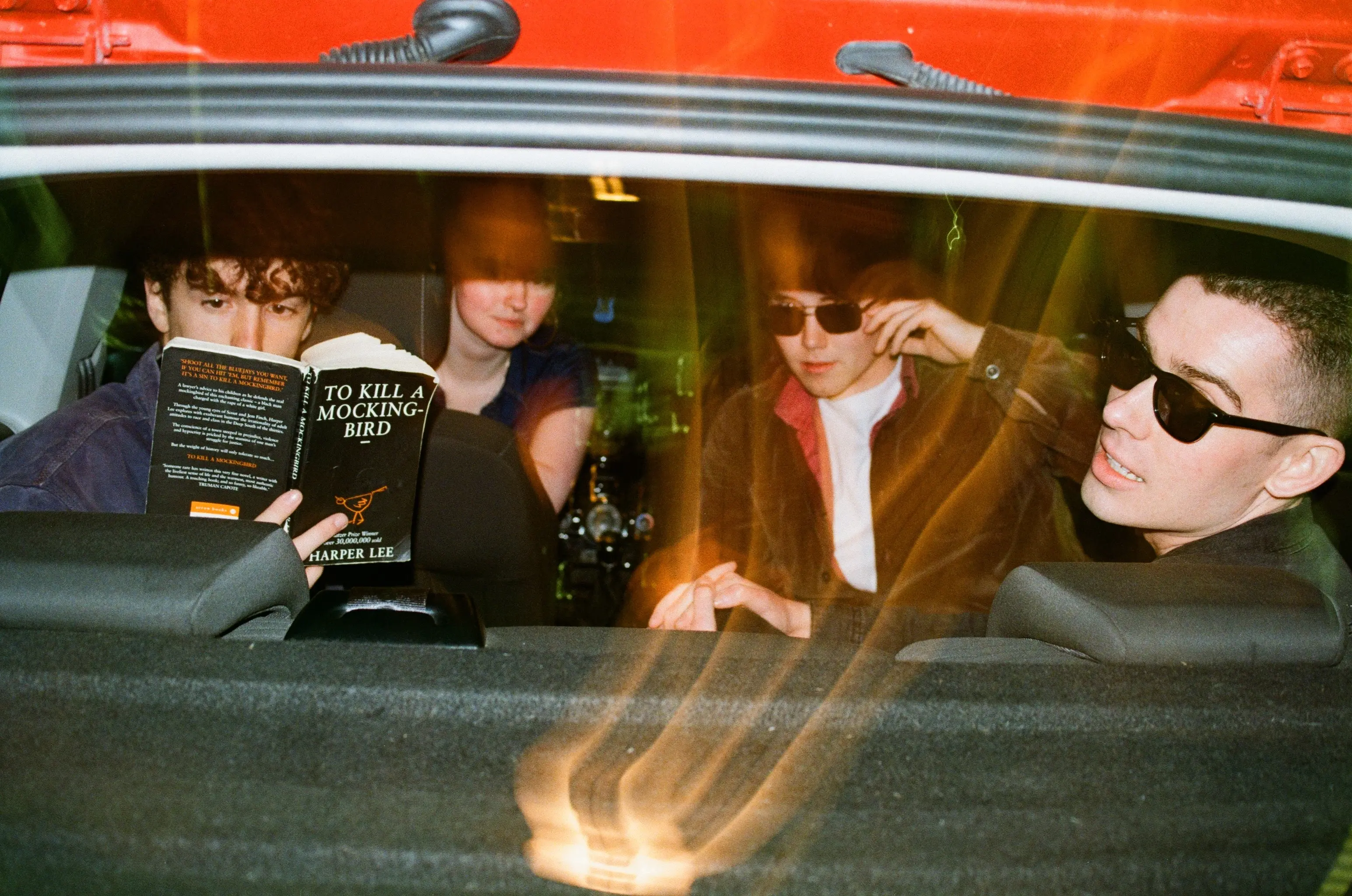 Dugout band members posing in car