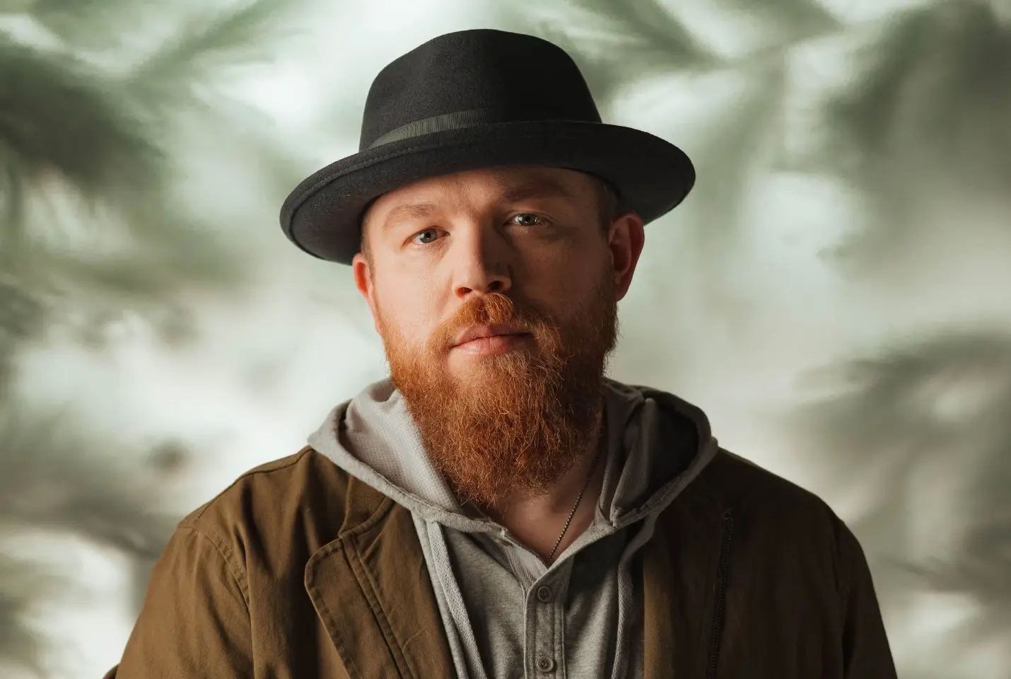 Close up image of Tyler Braden wearing a brown hat