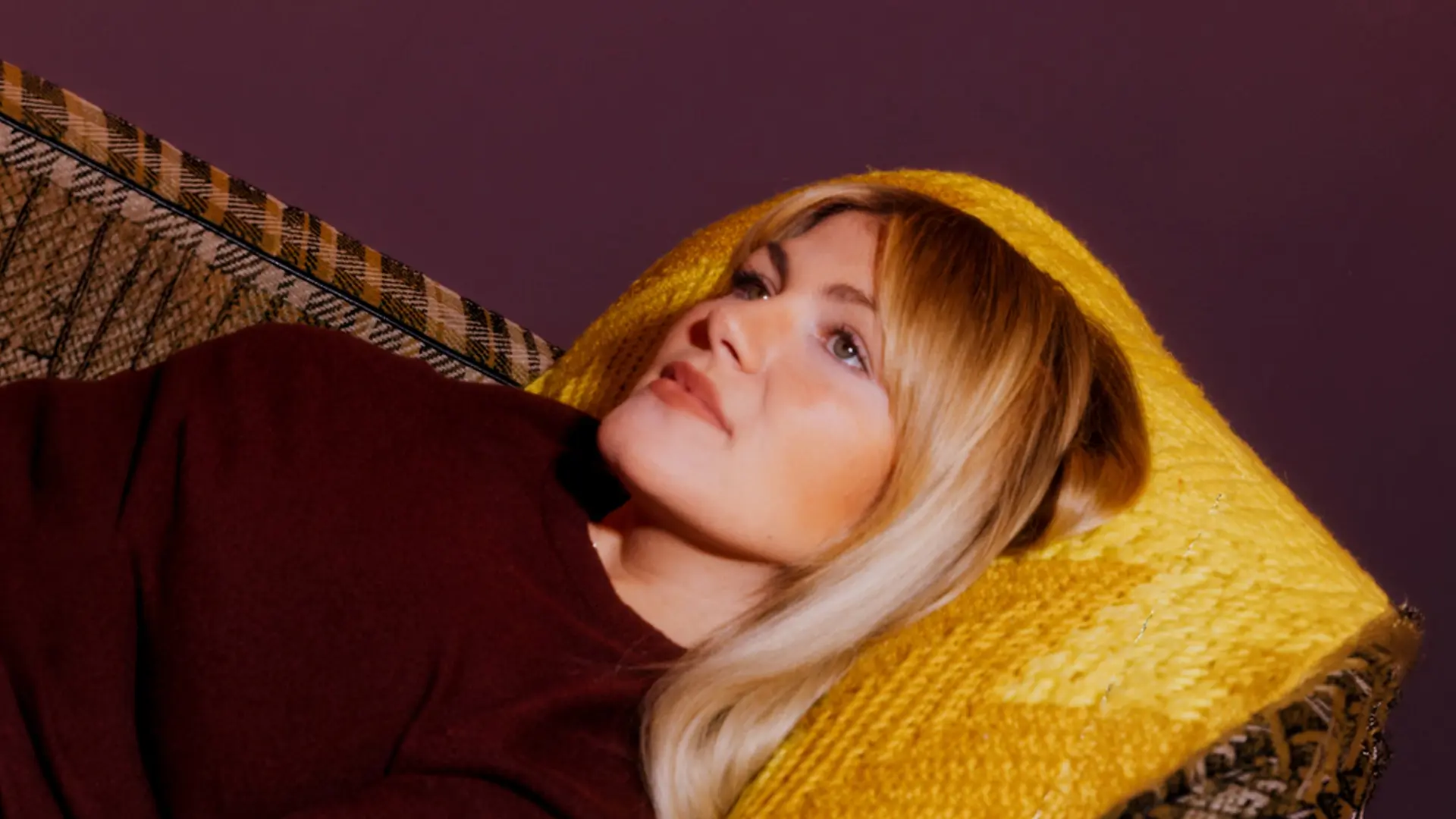 Girl lying down with head rested on pillow