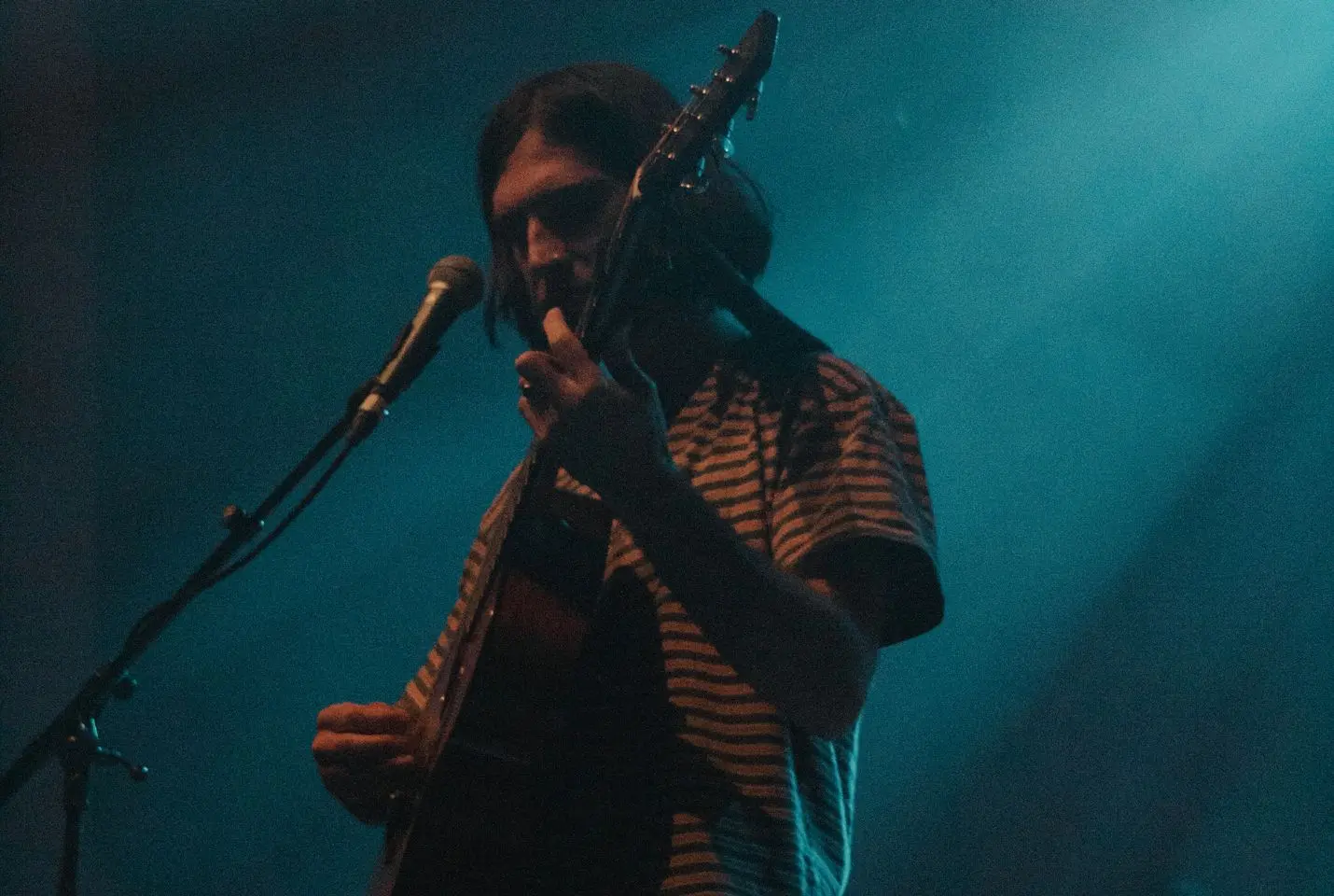 Mountain Boy on stage with a guiatr