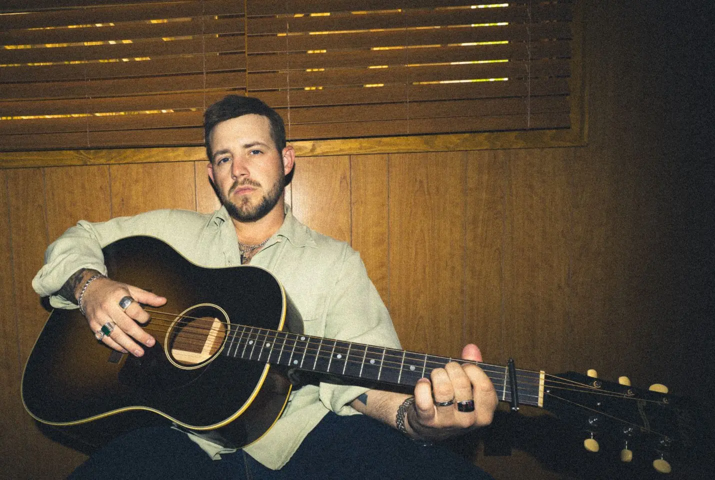 Kameron Marlowe playing a guitar