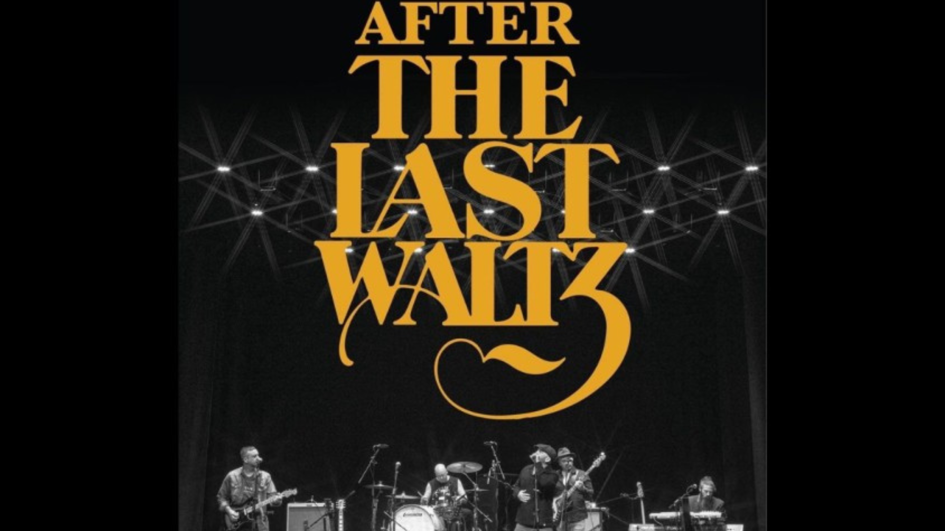 Promotional picture of the band after the last waltz with the band on stage and the name in yellow font