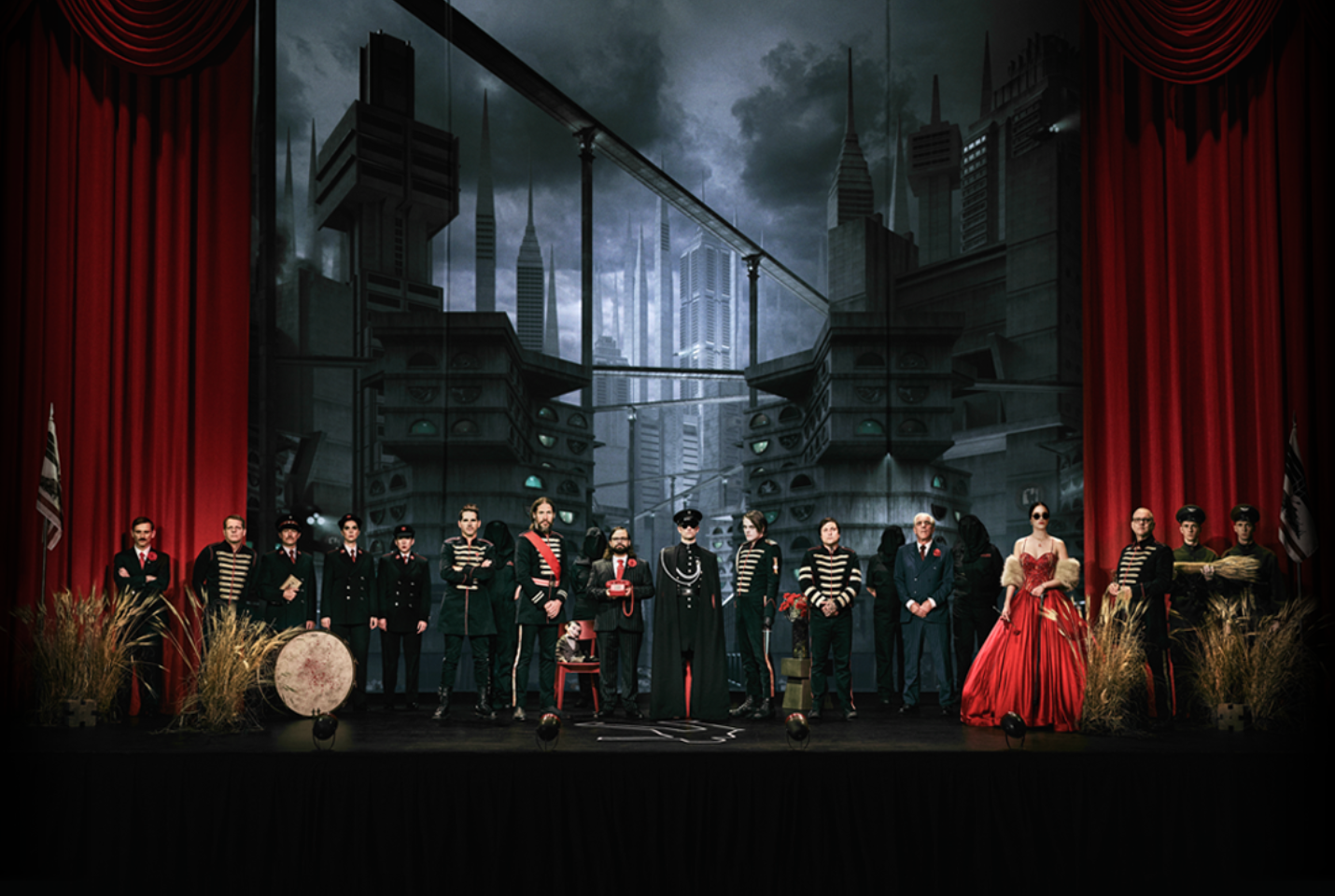 Group of people standing on a stage dressed in military uniforms