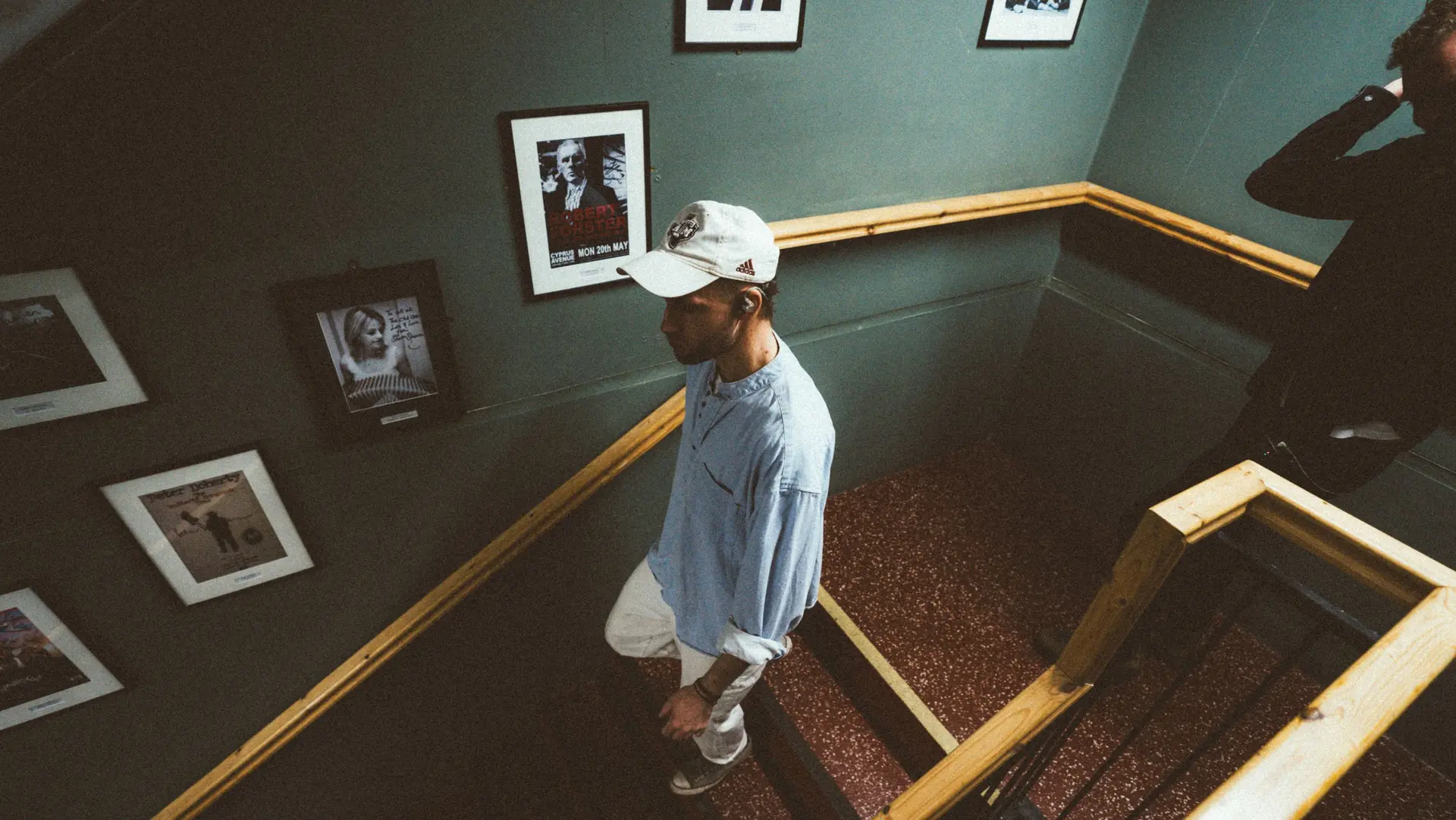 Pa Sheehy walking down a set of stairs