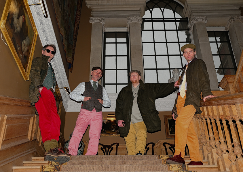 Members on The Beta Band on steps.