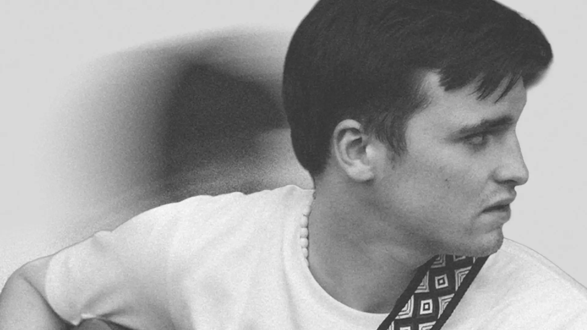 B&W image of Dan Parks playing a guitar