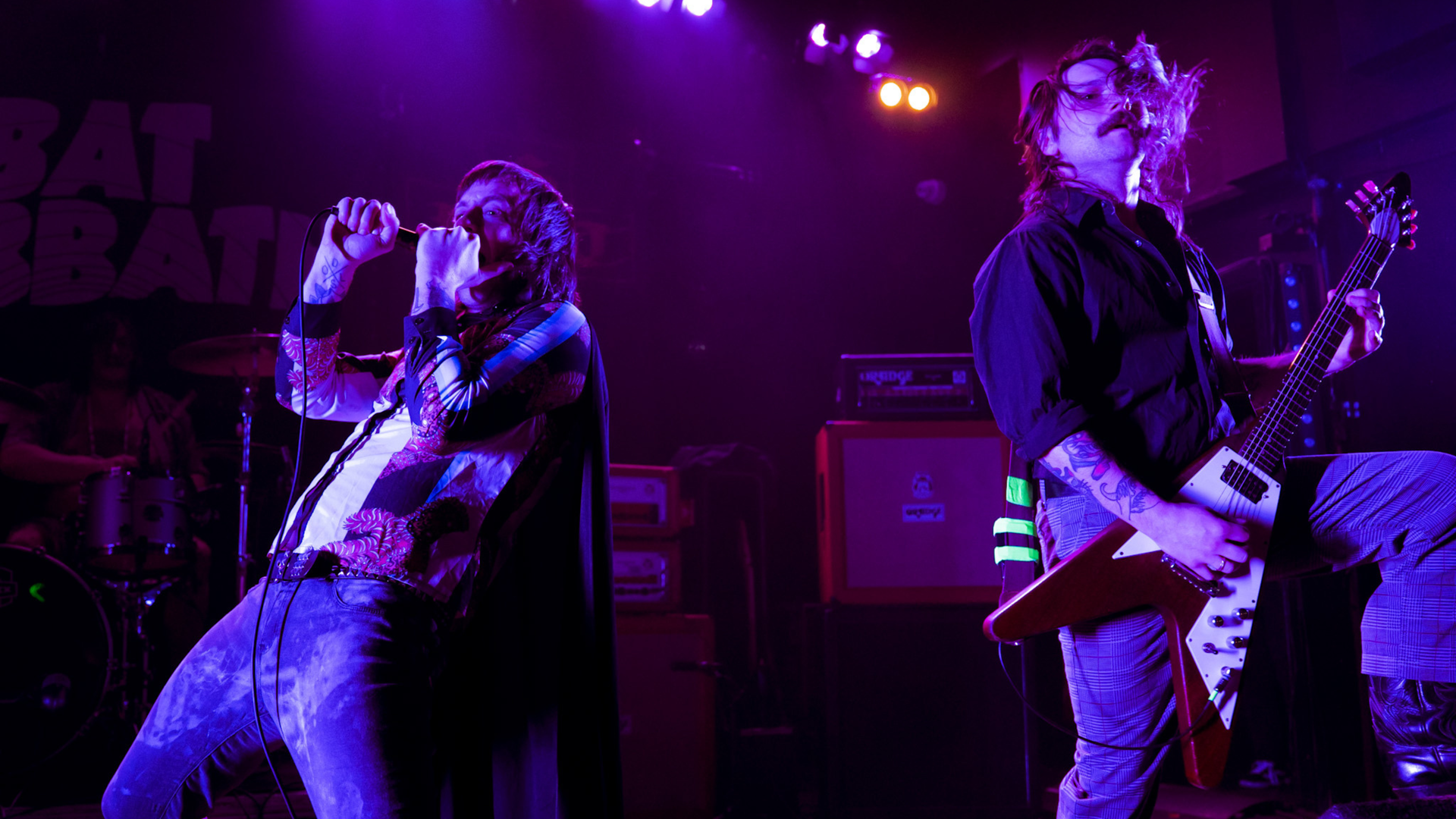 Members of Bat Sabbath on stage.