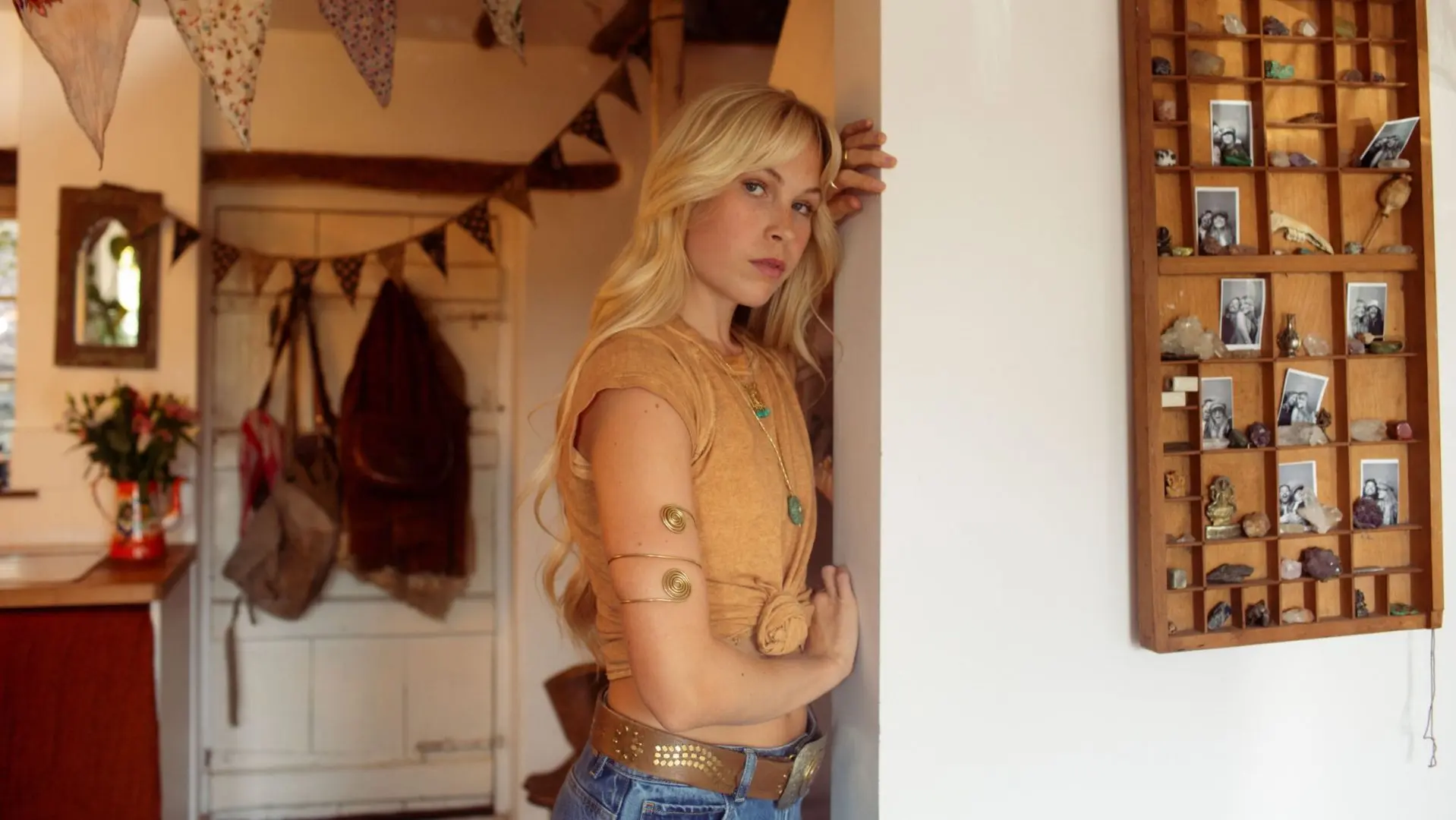 Maya Lane leaning against a wall