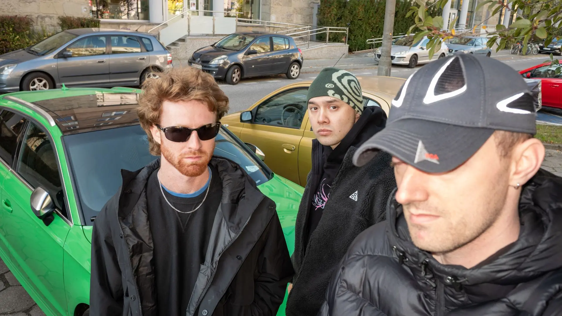 Trio Shady Nasty in front of a green car