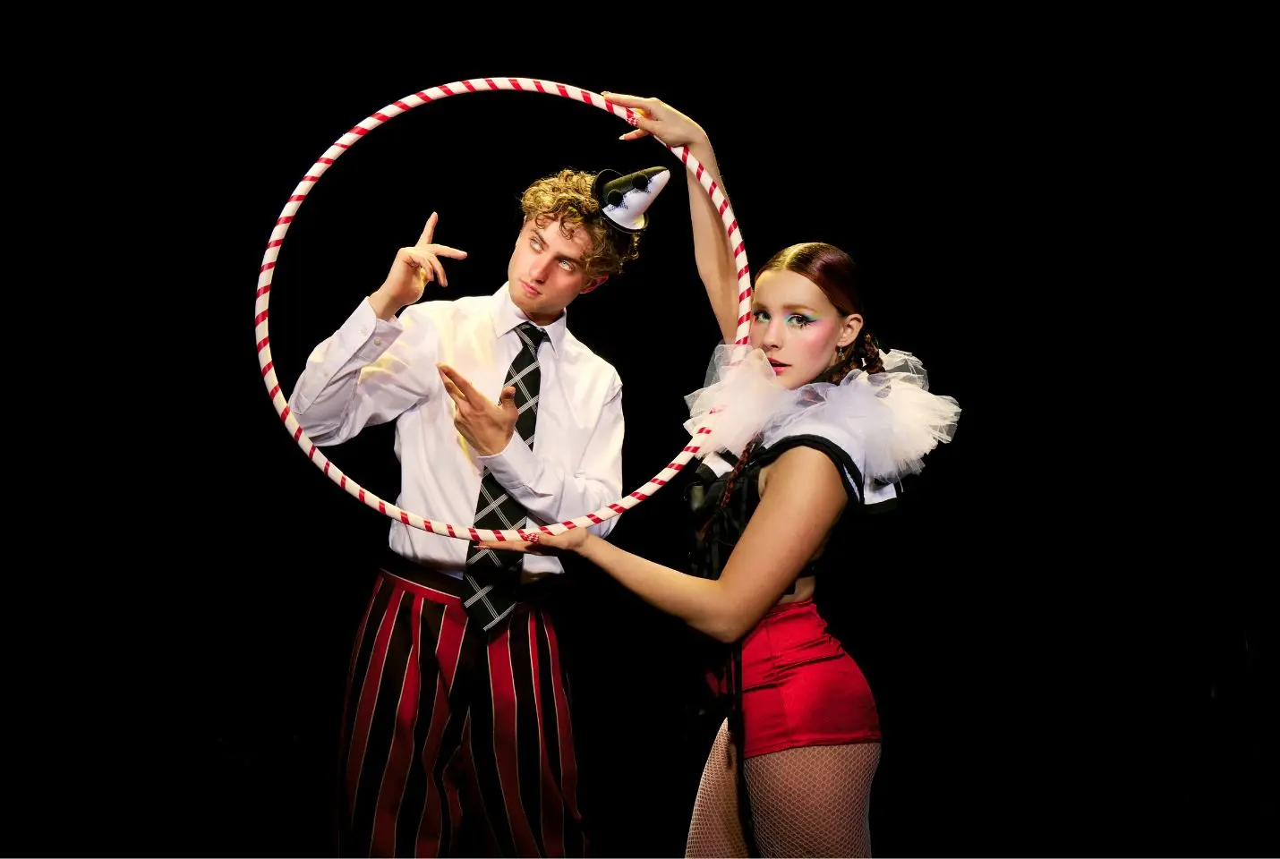 Two people wearing clown inspire outfits
