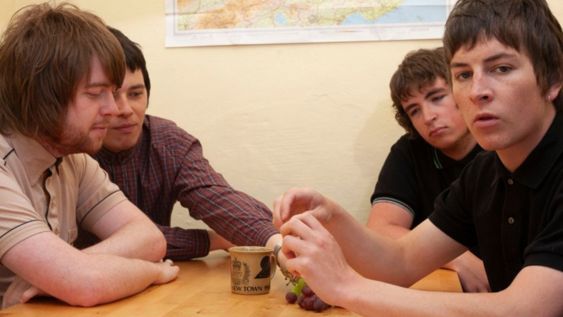 Four members of Sergeant sitting at a table