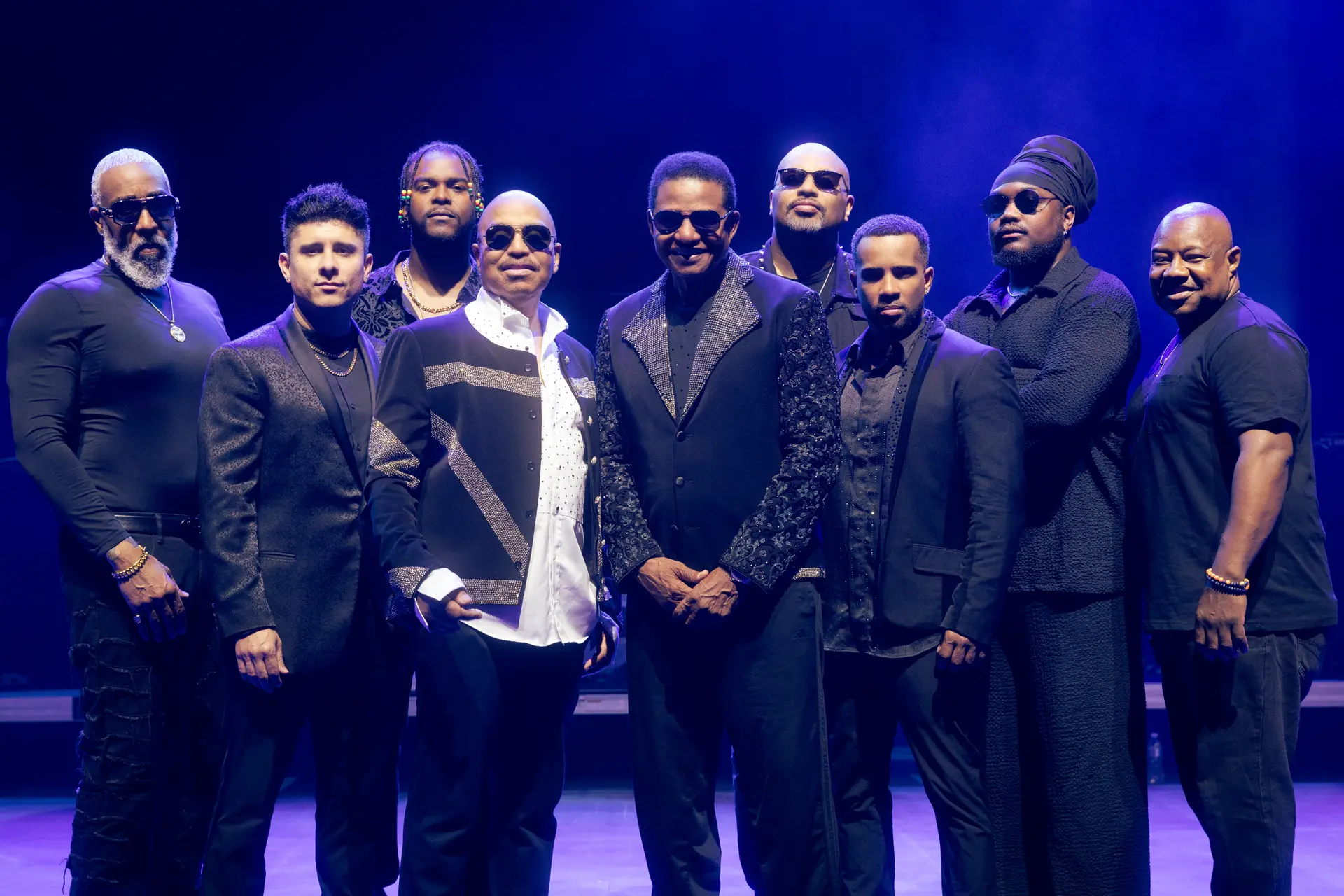 The Jacksons stood together on stage.