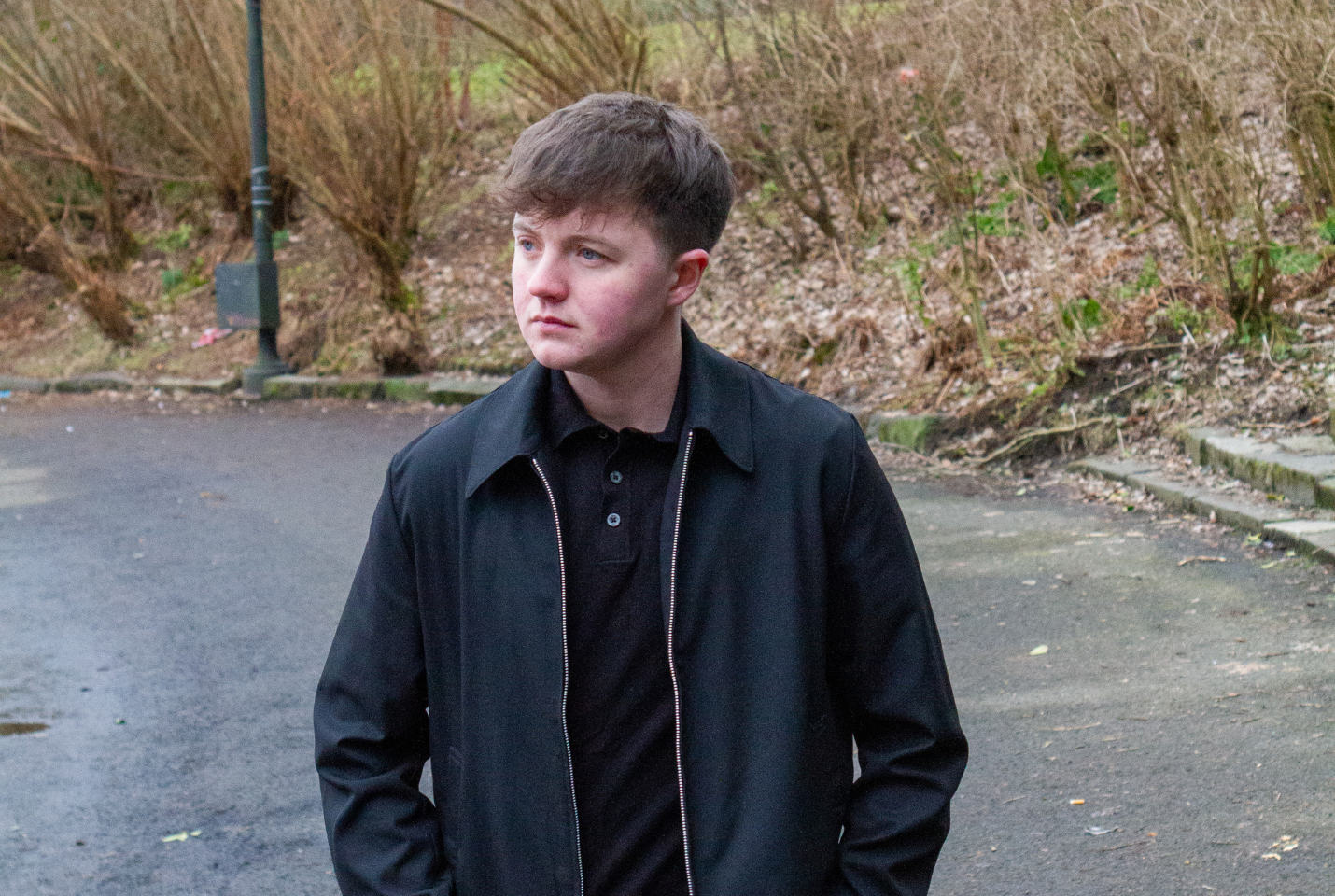 Ryan Brown posing on an autumns day on a path