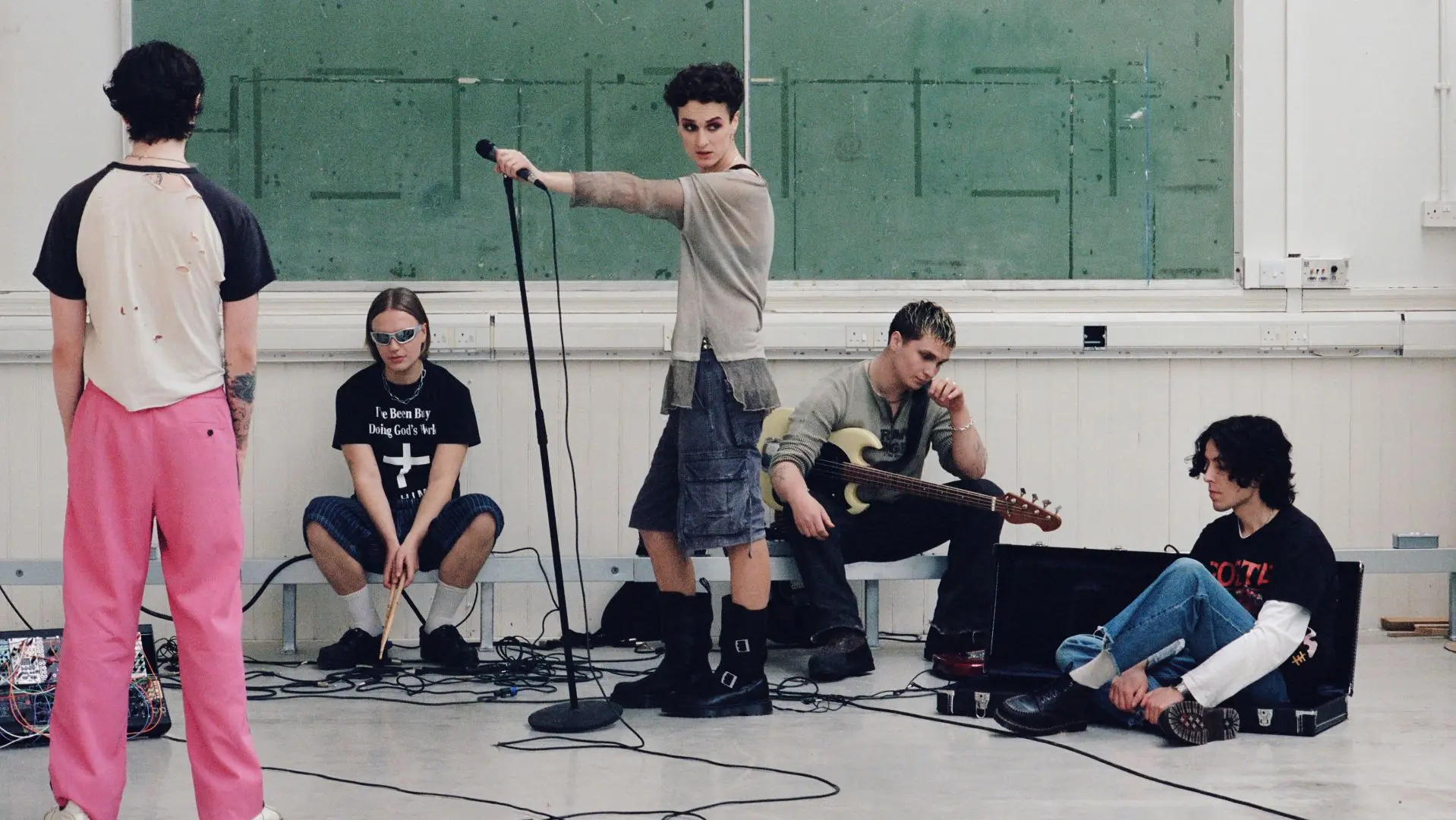 Members of Walt Disco in front of a white backdrop