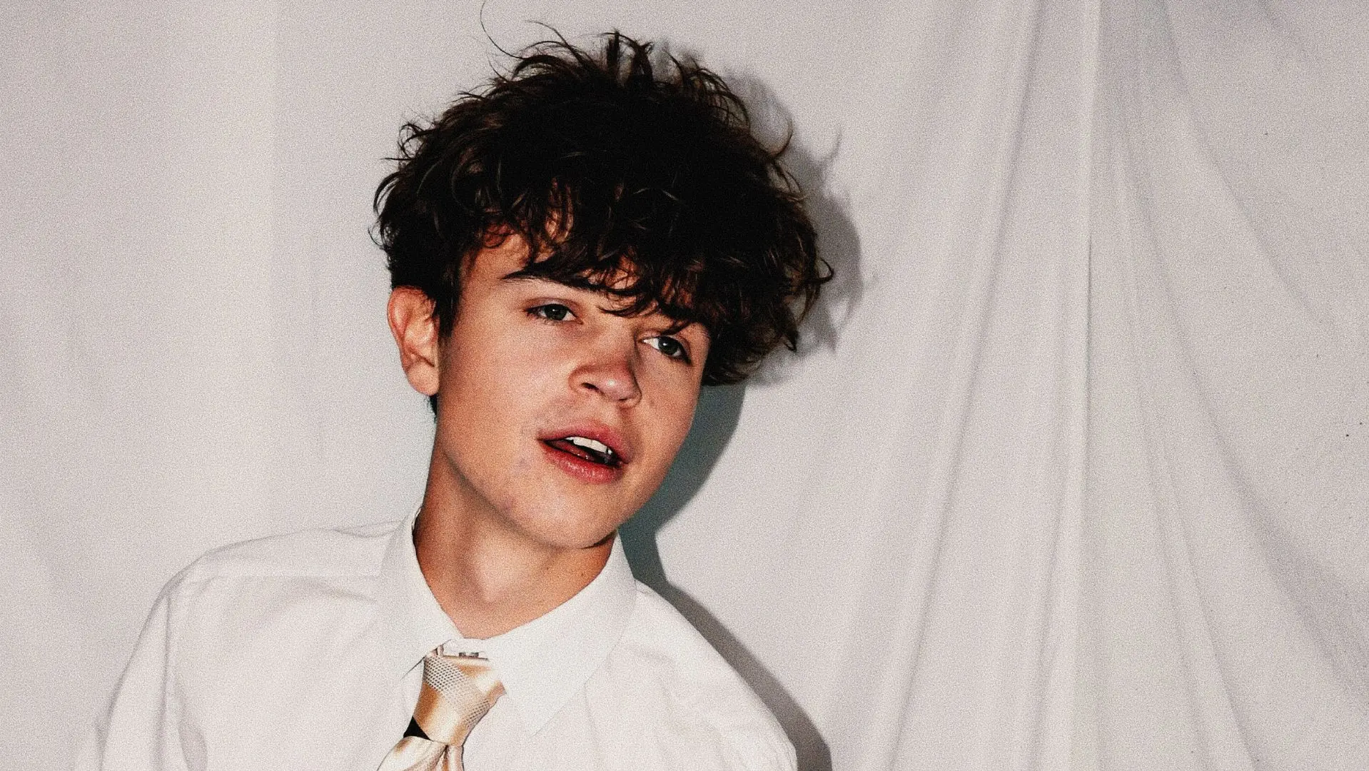 Tom A. Smith in a white shirt and tie